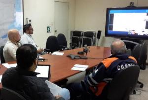 EOC members in a video conference with CONAE
