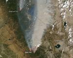 Red outlines represent hot spots where MODIS detected unusually warm temperature