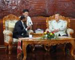 UN-SPIDER officer Shirish Ravan with the Minister of Agriculture of Lao PDR