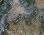 Satellite image of active wildfires across Western U.S., outlined in red (Image: NASA)