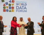 Abdulla Nasser Lootah, Director General, FCSA, UAE, presents a silver falcon to Maya Tissafi, Ambassador of Switzerland to the UAE, as the host of the next World Data Forum. Image: IISD/ENB | Kiara Worth