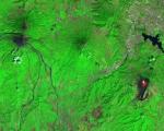 Image captured by Sentinel-2 on February 8 2021 of the Fuego volcano (left), Pacaya volcano (right), Guatemala City (upper right), with volcano lava visible in red. Image: Sentinel Hub, ESA.
