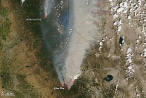 Red outlines represent hot spots where MODIS detected unusually warm temperature