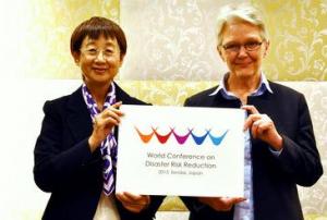 Mayor of Sendai City and UNISDR Chief present the Logo of the Conference