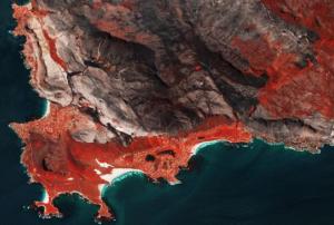 Sentinel-2 image shows burnscars near Cape Town, South Africa. The false-colour image shows burnt areas in dark greys and browns, and areas covered with vegetation in red.Image: ESA/ CC BY-SA 3.0 IGO.