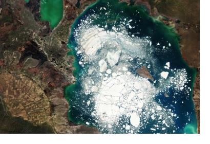 This Copernicus Sentinel-2 image shows Kazakhstan’s Alakol Lake on which large chunks of broken ice float in 5 April, 2016. Climate change threatens to disappear more than one third of Central Asia’s glaciers raising the disaster risk for vulnerable communities. Image: ESA.